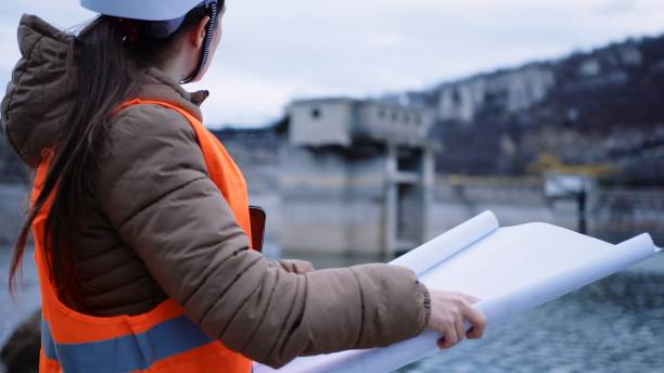 istock Female engineer working in hydroelectric dam. Ecology orientated. Renewable energy systems. 1370595585