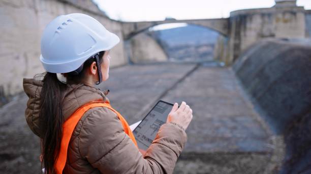 istock Female engineer working in hydroelectric dam. Ecology orientated. Renewable energy systems. 1370595596