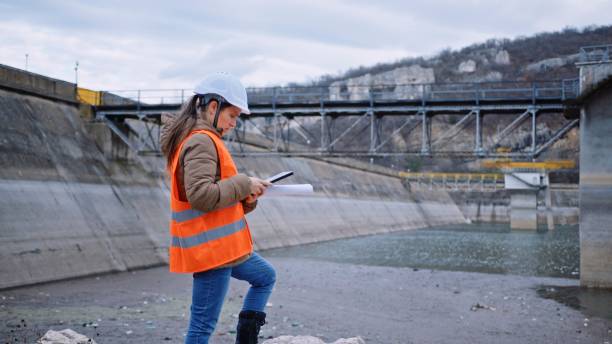 istock Female engineer working in hydroelectric dam. Ecology orientated. Renewable energy systems. 1370595603