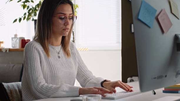 istock Young woman working at home in COVID-19 lockdown. 1370595605