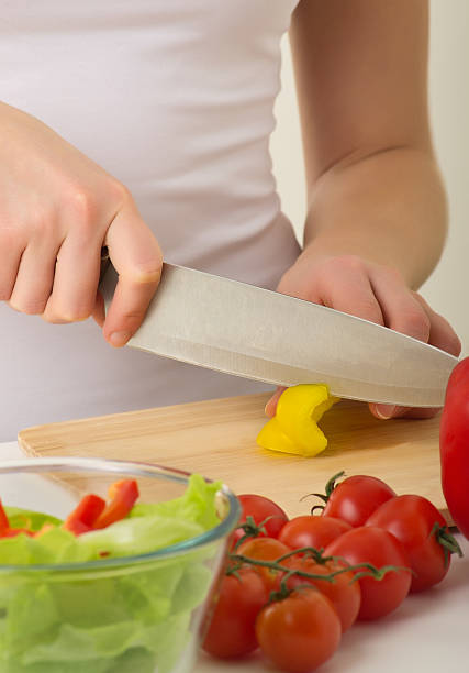 istock Human hands cooking vegetables salad in kitchen 137059774