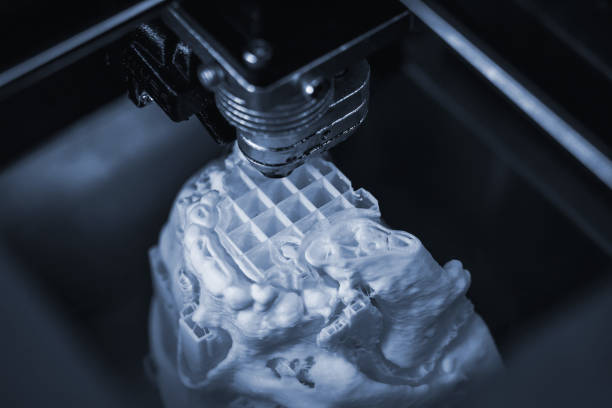 istock 3D printer prints the form of molten plastic white. 1370597962