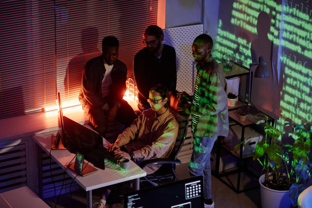 istock Group of young intercultural software developers working at night meeting 1370598629