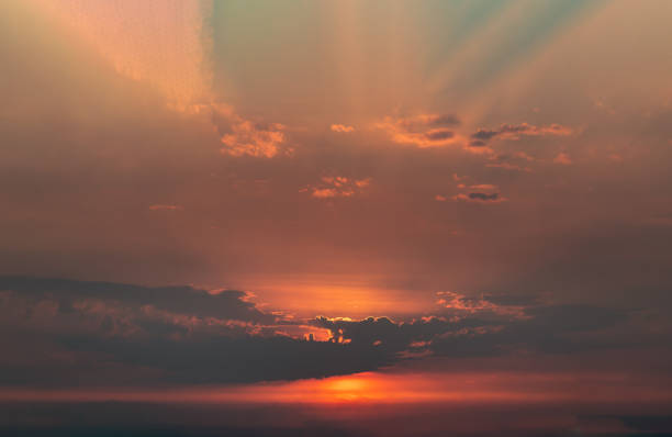 istock Beautiful orange sunset sky above clouds with dramatic light, Beautiful blazing sunset landscape. 1370600401