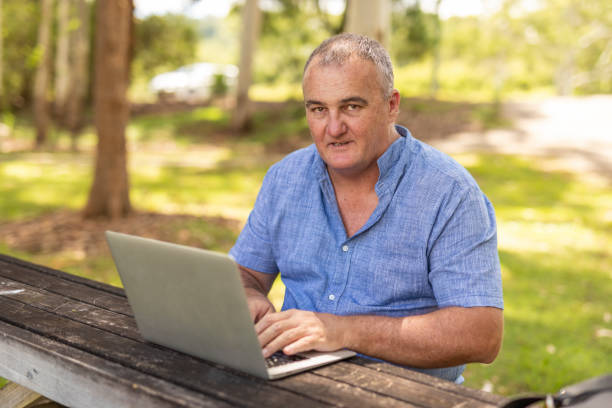 istock Entrepreneur Working on a Laptop Outdoors 1370601104