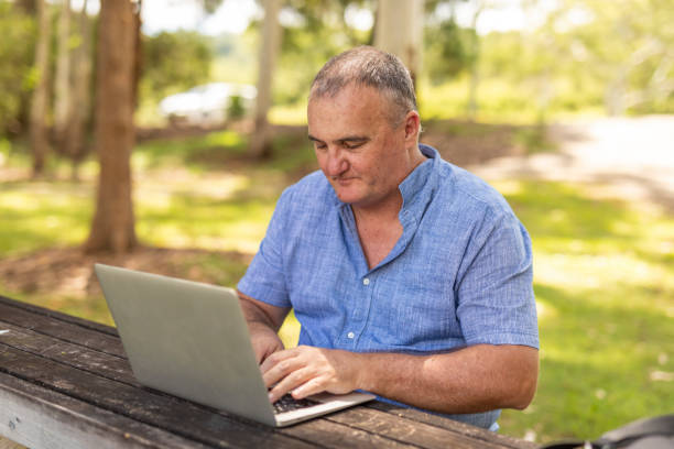 istock Entrepreneur Working on a Laptop Outdoors 1370601105