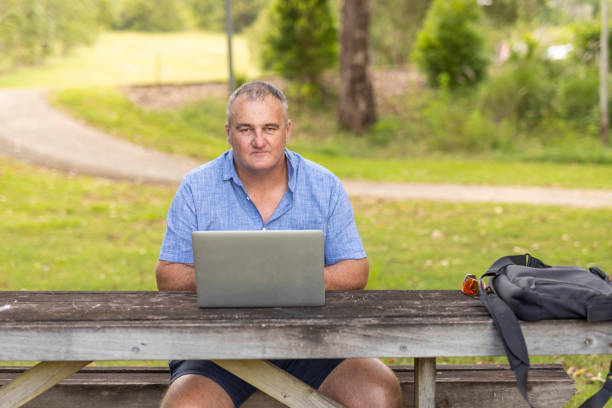 istock Entrepreneur Working on a Laptop Outdoors 1370601134