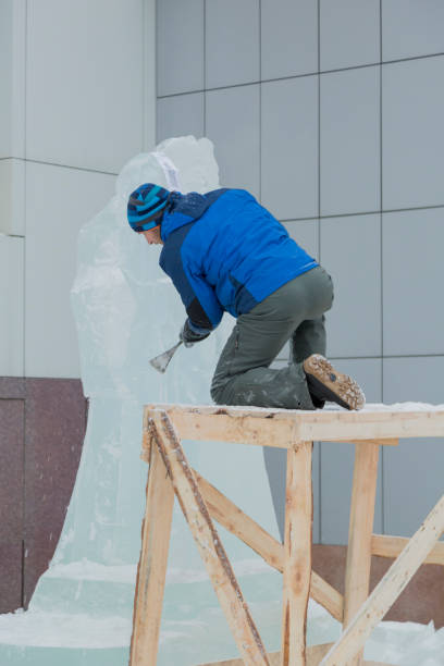 istock Portrait of a sculptor at work on a figure 1370602549