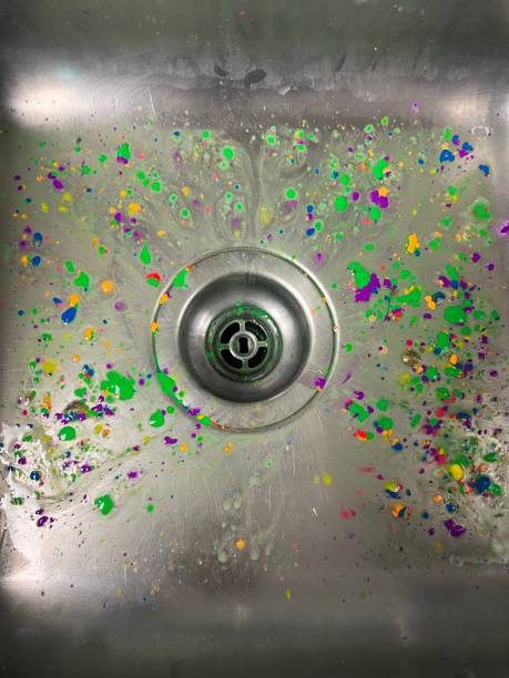 Metal sink with paint splatter