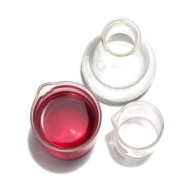 istock Chemicals ingredient on white laboratory table. Potassium Permanganate Liquid in beaker and Alcohol in Erlenmeyer flask. 1370610273