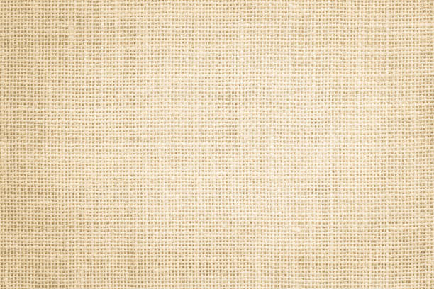istock Jute hessian sackcloth burlap canvas woven texture background pattern in light beige cream brown color blank. Natural weaving fiber linen and cotton cloth texture as clean empty for decoration. 1370614466