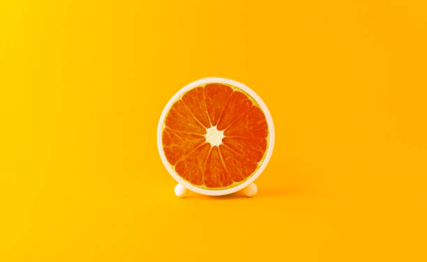 istock Creative and innovative ideas with circle oranges like time. Artistic concepts and mixing ideas image of orange imagination 1370615401