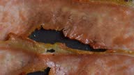 istock Tasty hot bacon cooked on frying pan 1370615440