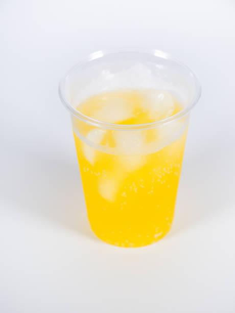 istock Orange soda Plastic cup, close up photo 1370616702