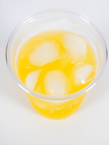 istock Orange soda Plastic cup, close up photo 1370616715