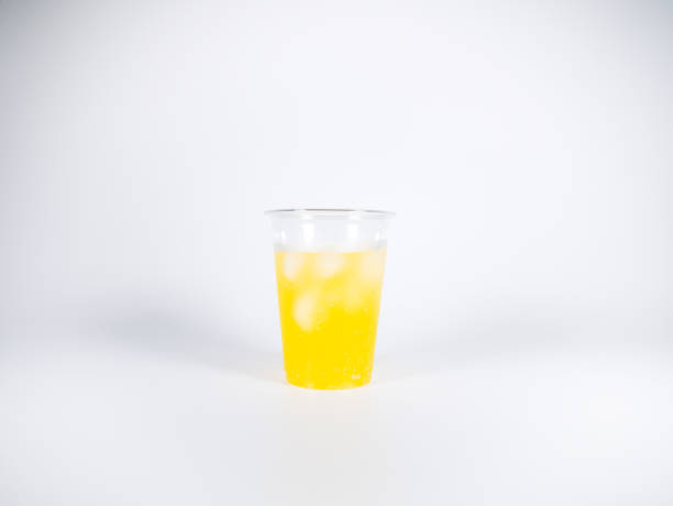 istock Orange soda Plastic cup, close up photo 1370616774