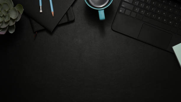 istock Stylish black office desk top view, flat lay with copy space 1370619093