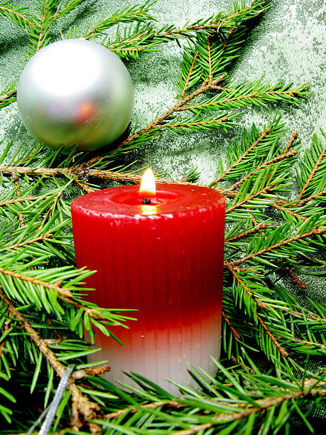 istock red candle and christmas among fir branches 137062208