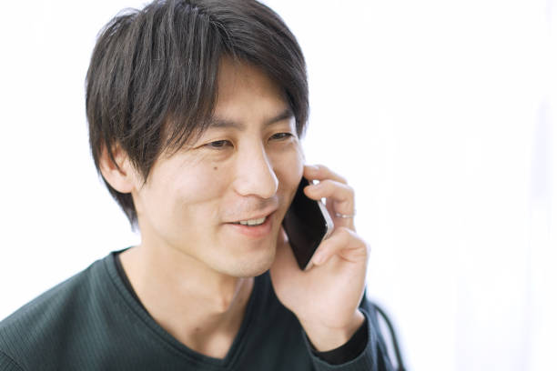 Asian female talking on smartphone