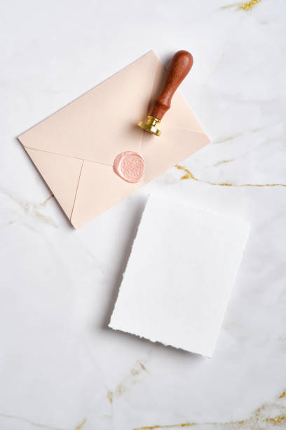 Wedding RSVP mockup and pink envelope with wax seal stamp on marble table. Flat lay, top view. Wedding RSVP mockup and pink envelope with wax seal stamp on marble table. Flat lay, top view. pink envelope stock pictures, royalty-free photos & images