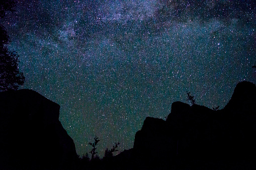 The Milkyway over features in Yosemite Valley such as; El Capitan, Bridalveil Falls and the Three Sisters. Taken in Yosemite National Park.