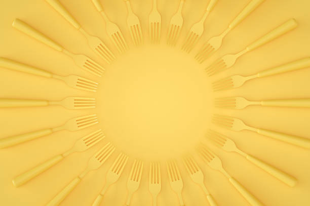 Forks, minimal kitchen restaurant concept with kitchen utensils on yellow background.