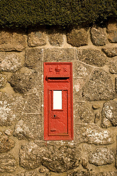 istock Red Postbox in English Village Wall 137063511