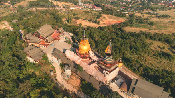 istock Wat Somdet Phu Ruea Ming Mueang Temple 4k fly over aerial view. 1370641288