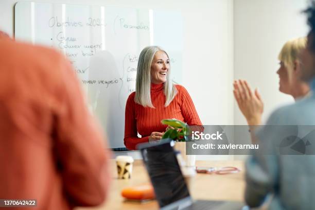 Barcelona Businesswoman Presenting Objectives For New Year Stock Photo - Download Image Now
