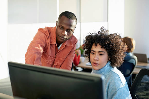 istock Young Black and Hispanic colleagues working on project 1370642434