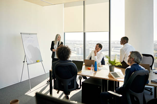 istock Female project manager discussing future trends with team 1370642446