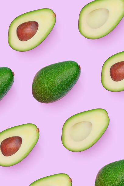 istock set of patterns of avocado cut in half on a light pink background 1370644006