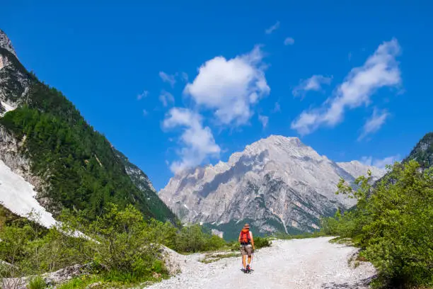 Trekking in Val d'Oten (Oten Valley) in the Dolomites, in view of the Monte Antelao, known as the "King of the Dolomites", the second highest Dolomites peak