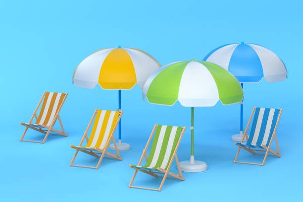 Beach chairs with umbrellas and beach ball on blue background. 3D render of summer vacation concept