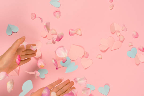 istock Paper pink hearts pastel pink background. 1370649182