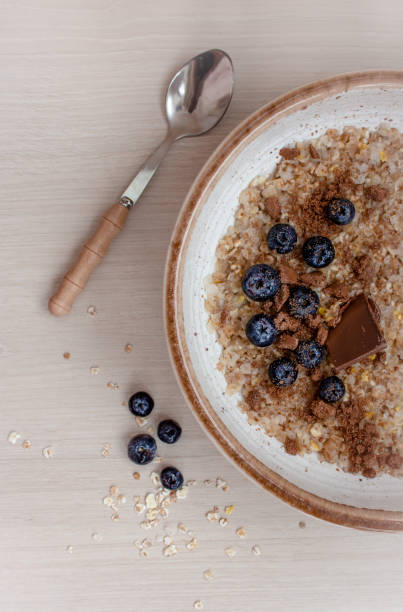 istock cereal porridge with blueberries and chocolate for breakfast 1370652867
