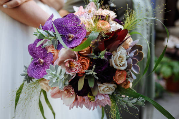 istock Bride in Wedding Dress with Wedding Bouquet in Hands 1370657322