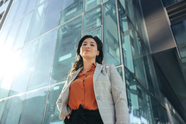 istock Self-confident businesswoman looking at the camera outside her workplace 1370660076