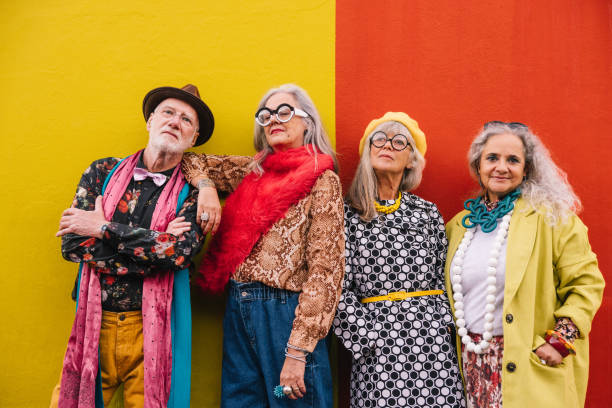 istock Vibrant elderly people standing together against a wall 1370660766