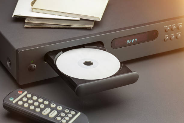 Listening equipment love music, leisure, leisure, entertainment. CD player and sound control panel, close-up. Discs in envelopes on the cover of the player. open cd player stock pictures, royalty-free photos & images