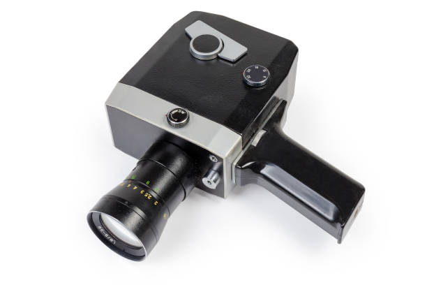 istock Old amateur mechanical movie camera on a white background 1370661614