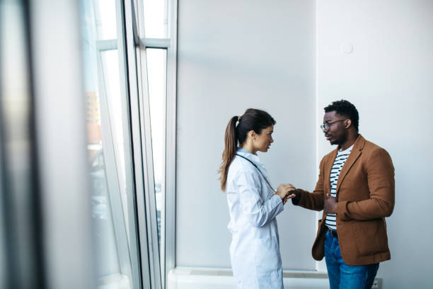 istock Doctor and patient standing to each other 1370663855