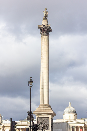 Admiral Nelson in Nelson's Column at Trafalgar Square in City of Westminster, London. At the base is the National Portrait Gallery and the statue of Charles I.