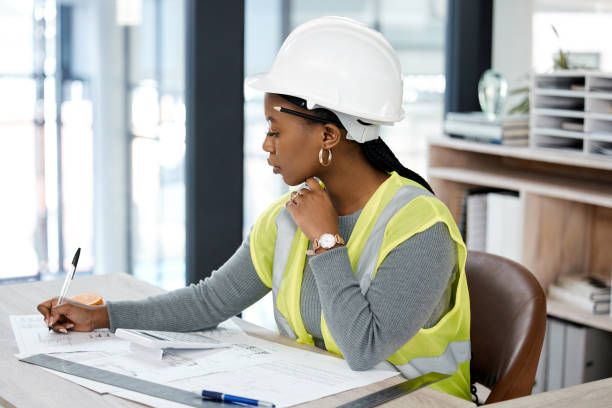 istock Shot of a female engineer drawing up blueprints 1370666641