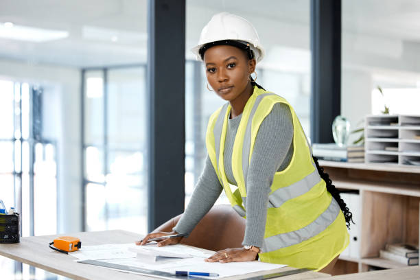 istock Shot of a female engineer drawing up blueprints 1370666648
