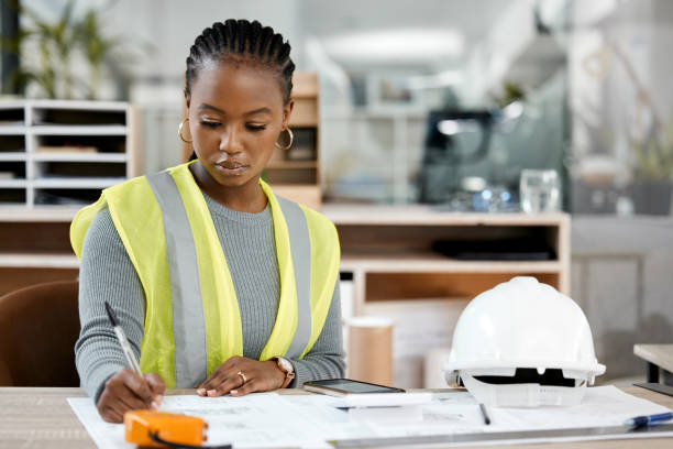 istock Shot of a female engineer drawing up blueprints 1370666650
