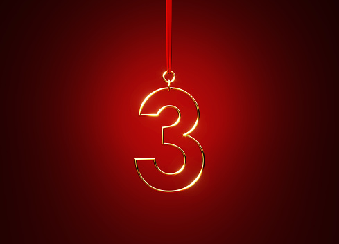 Number 3 hanging from a red ribbon over red background. Horizontal composition with copy space.