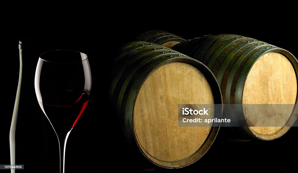 red wine red wine glass and barrels on black background Alcohol - Drink Stock Photo