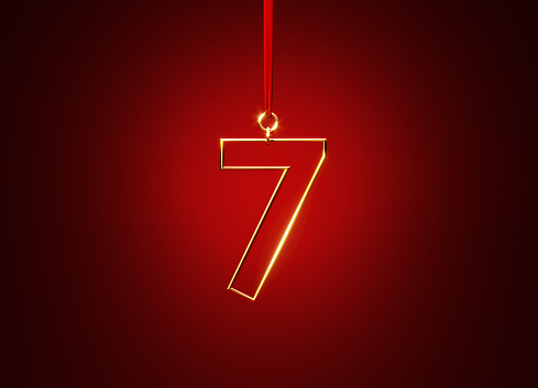 Number 7 hanging from a red ribbon over red background. Horizontal composition with copy space.