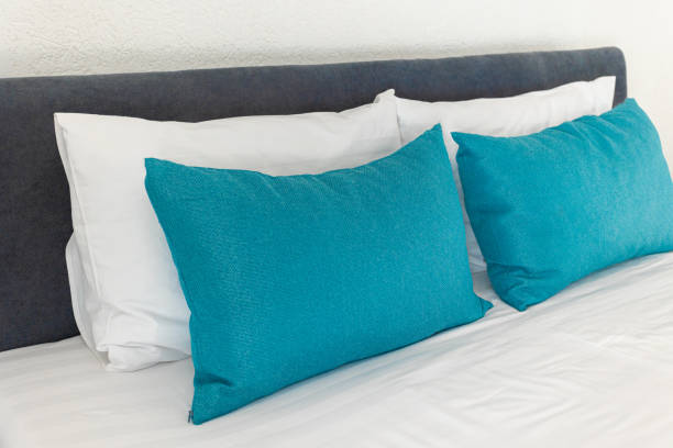 istock beautiful white and blue pillows lie on the bed 1370669183
